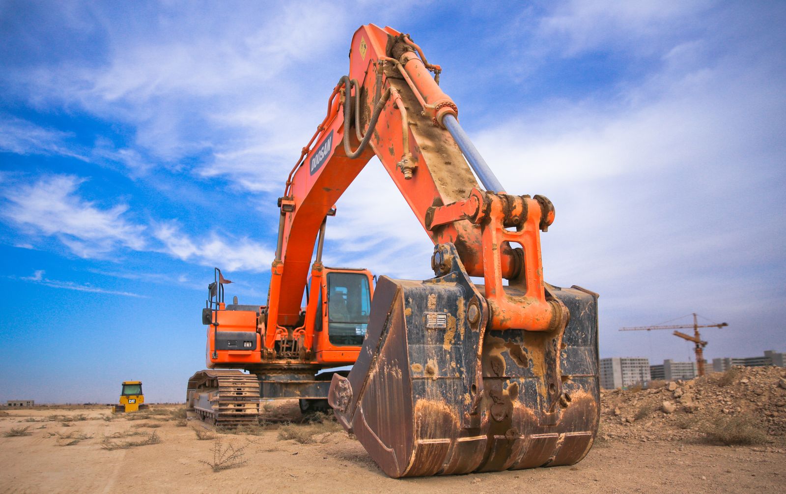 Excavator on a cleared construction site